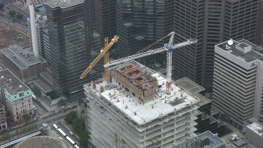 Realtime shot of construction cranes. Downtown Toronto.