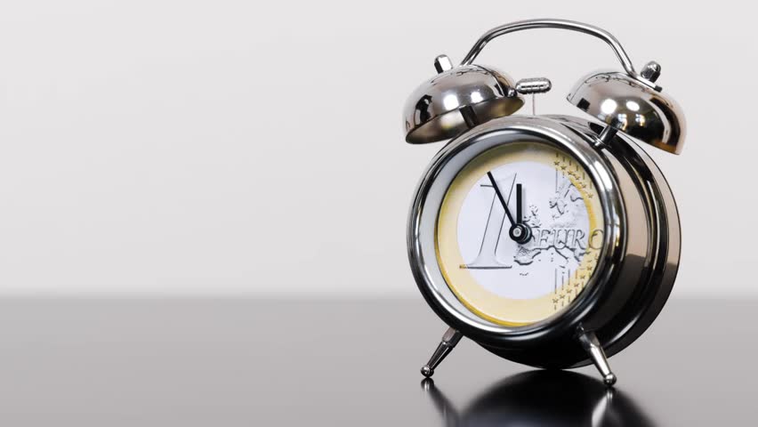 time-lapse of an alarm clock symbolizing an euro coin
