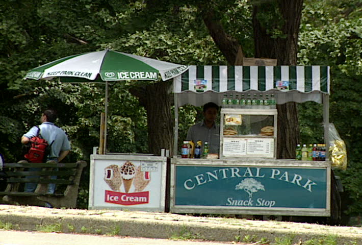 NEW YORK - Circa 2002: Unidentified pedestrians walk by Central Park Snack shop street vendor in Central Park NYC in 2002
