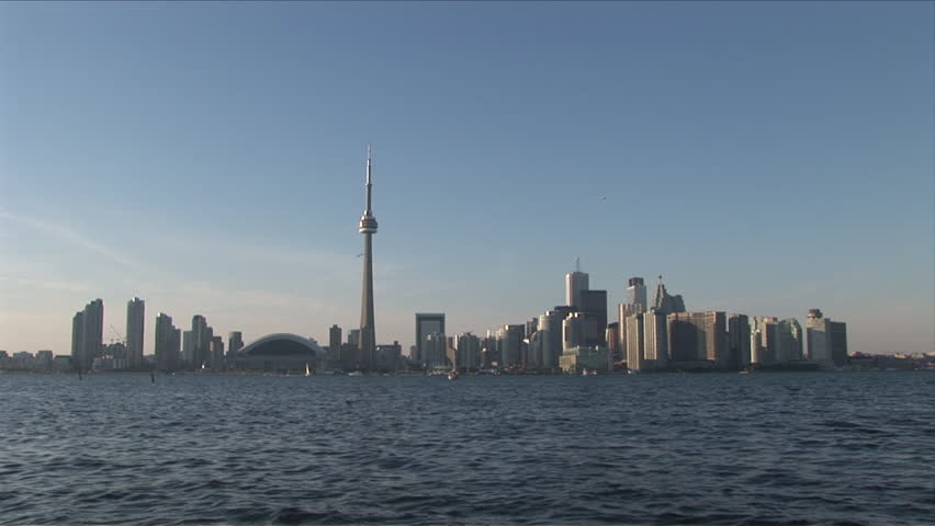 Extremely wide shot of the skyline as seen from Lake Ontario in Toronto Canada