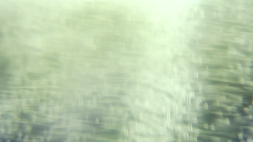 Macro clip of liquid, bubbles and froth. Abstract video that could be used as effect, transition or background and even as a conceptual video.
