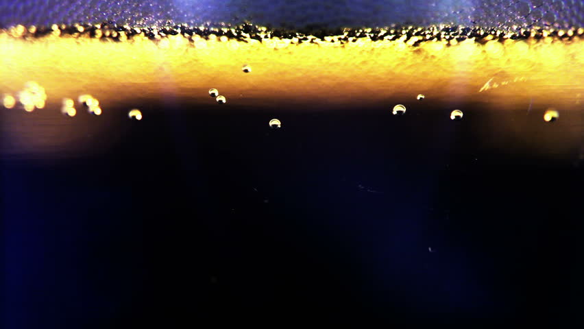 Macro clip of liquid, bubbles and froth. Abstract video that could be used as effect, transition or background and even as a conceptual video.
