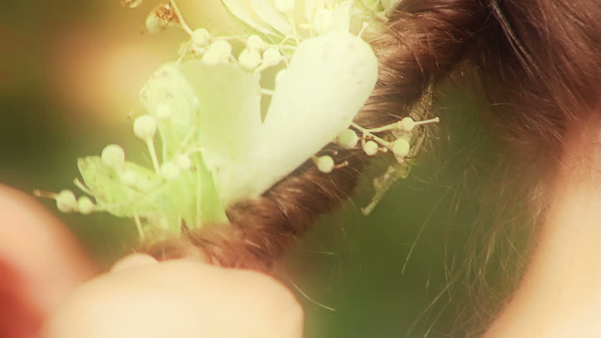 Fairies of the Forest (Young girls playing in a forest. Hair braided with flowers of lime.)
