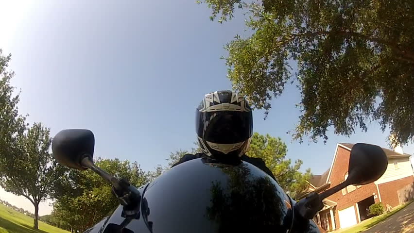 View from a camera attached to the front fender of the motorcycle up to the motorcyclist. GoPro camera