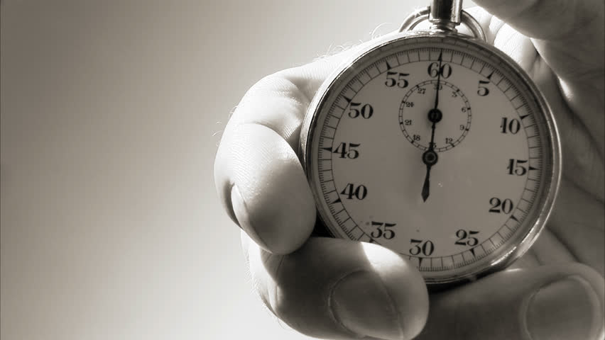 Hand starting up a stopwatch.