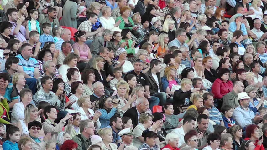 SUMY - JUNE 28: Crowd cheering on the city stadium celebrating the Day of the Constitution of Ukraine on June 28, 2012 in Sumy, Ukraine 