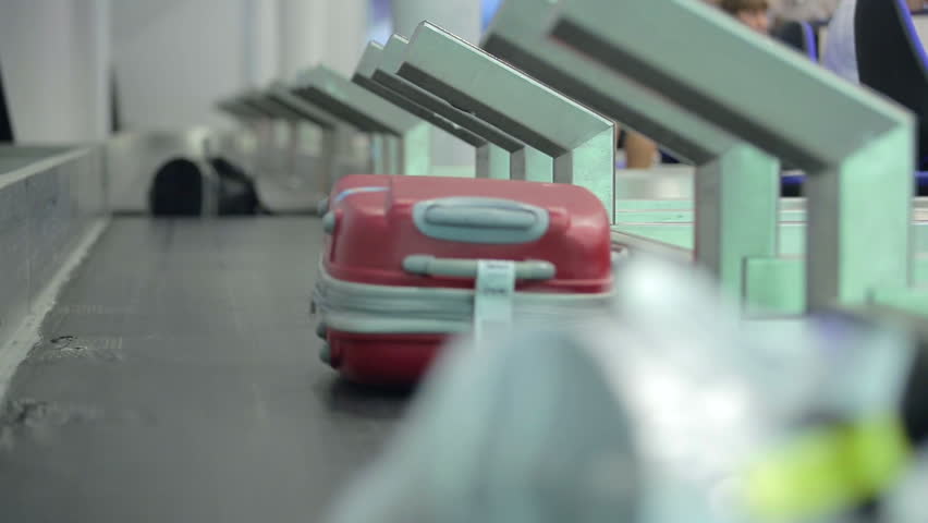 Luggage travels on a conveyor belt at the airport