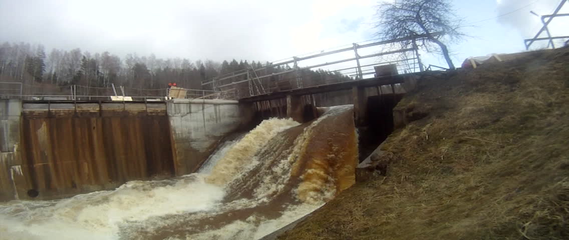 Dam releasing water at the Riga Hydroelectric Power Plant (or Riga HES), located along the Daugava River, in Riga, Latvia.