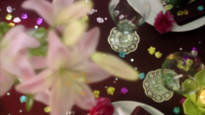 A table with confetti and streamers.