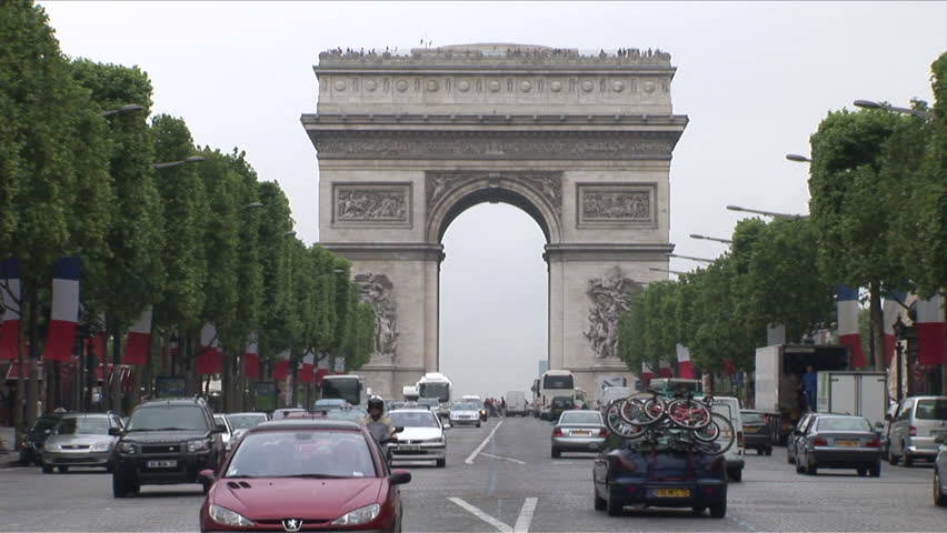 Paris, France - CIRCA June, 2006: The Arc de Triomphe stands proudly on the avenue forever a symbol of the grandeur of Paris