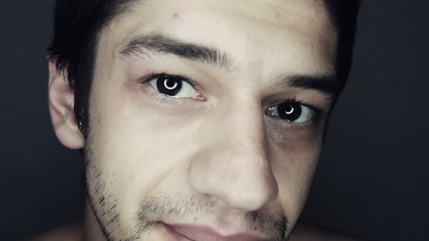 Unshaved Man Gazes into Camera