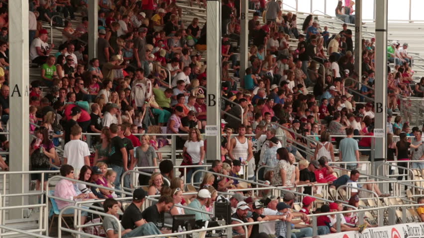 NEPHI, JUAB, UTAH 30 JUN 2012: Economic boost to rural community in annual race.  People in rodeo fair ground stadium seating. Juab County extreme enduro. Hard riding dangerous motor vehicle event.