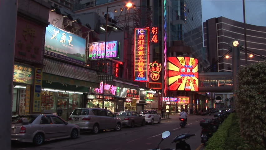 Macau, China - CIRCA March, 2007: Many intense neon signs of all sizes lights up a quiet street at night