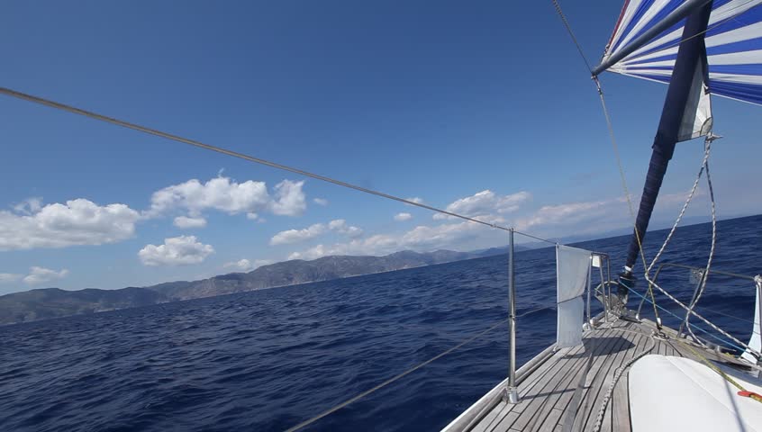 Sailing in the wind through the waves (HD) Sailing boat shot in full HD at the Mediteranean sea.