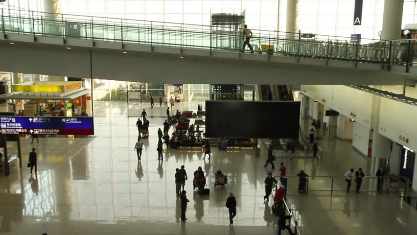 Time lapse of People in the arrivals hall at Hong Kong International Airport Terminal.