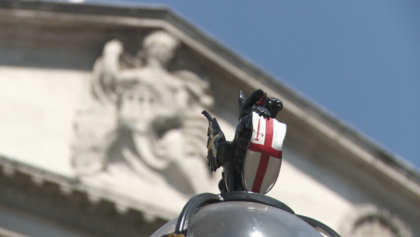 LONDON - CIRCA 2011: Bank of England from Griffin statuette on lamp post circa 2011 in London, England. Closeup detail and focus pull to the pediment