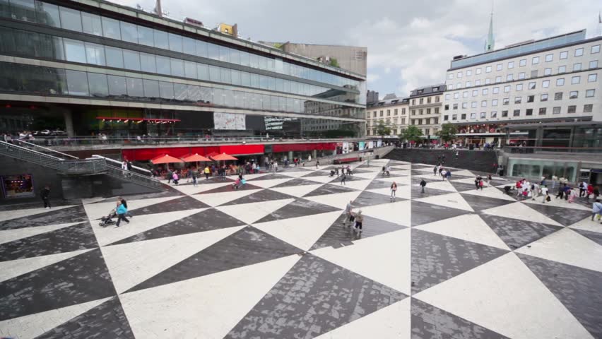 Many citizens walk by Sergels torg square in Stockholm
