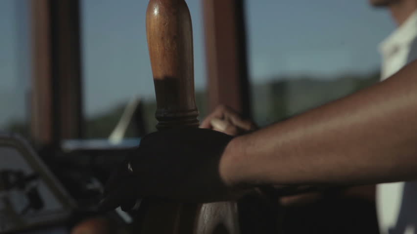 Captain at the helm of boat