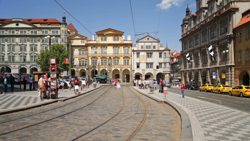PRAGUE, CZECH REPUBLIC - CIRCA MAY 2011: Prague City centre with its famous Red Trams and many Pedestrians