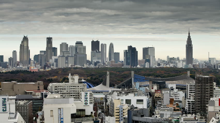 TOKYO, JAPAN - CIRCA MAY 2011: Moving clouds over Shinjuku business, shopping and entertainment district, viewed from Shibuya
