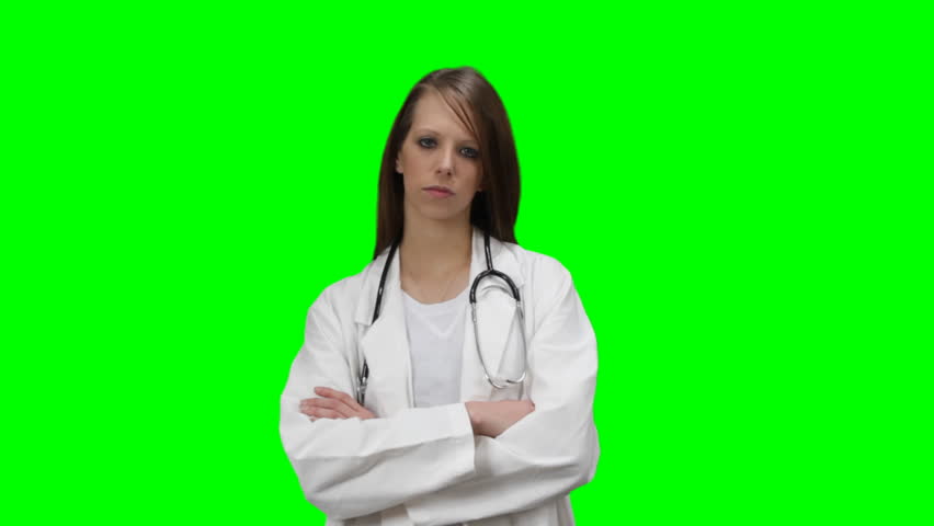 Serious doctor posing with an attitude. With a green chroma key background.