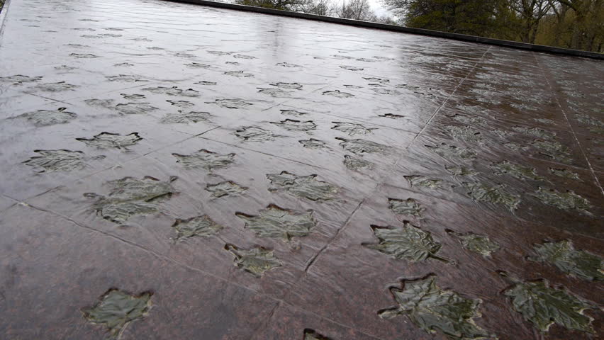 The Canada Memorial designed by Pierre Granche, in Green Park. It honors the members of the Canadian forces killed in both world wars.This clip shows a detail of the inset bronze maple leaves.