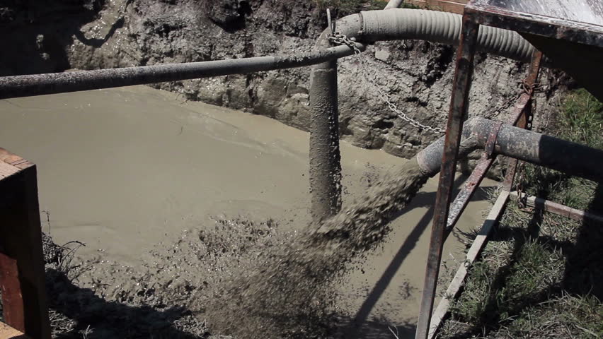 Industrial drain pipe discharging water into a drainage canal. HD1080p. 