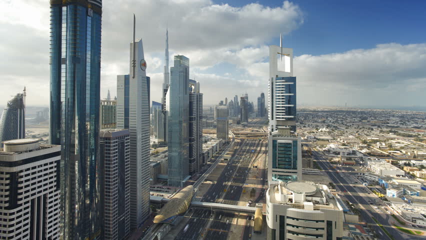 DUBAI, UNITED ARAB EMIRATES - CIRCA MAY 2011: Sheikh Zayed Rd, showing the new MTR track and station system and the Burj Khalifa in a skyline view.