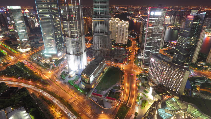 Bird's eye view of Shanghai in China at night, timelapse.