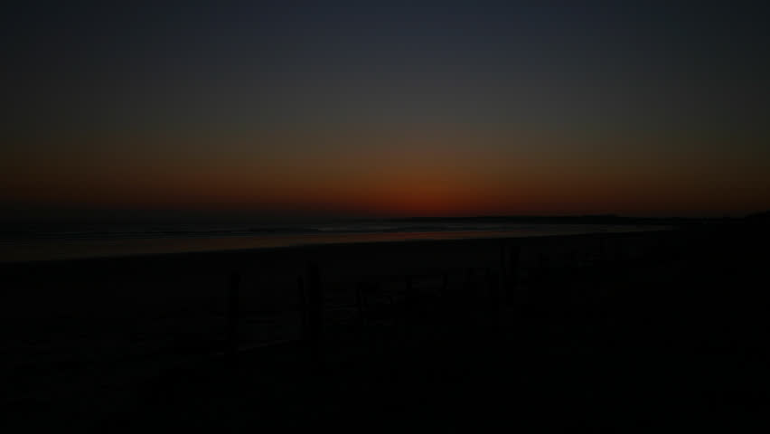 Time lapse shot of sunrise over an east coast beach