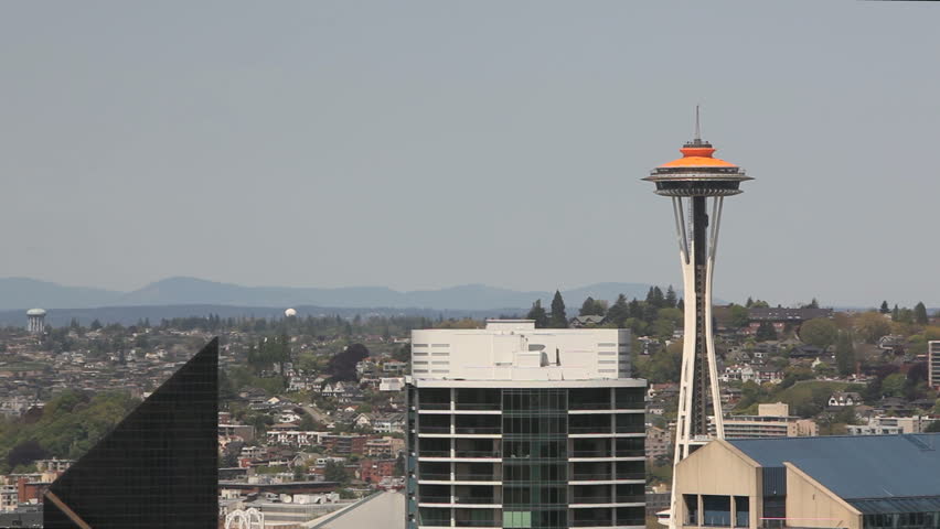 SEATTLE, USA - MAY 12: Space Needle at daytime with  elevators going up and down on May 12th 2012 in Seattle, WA, USA. Space Needle in orange painting 50 year anniversary of world exhibition in 2012.