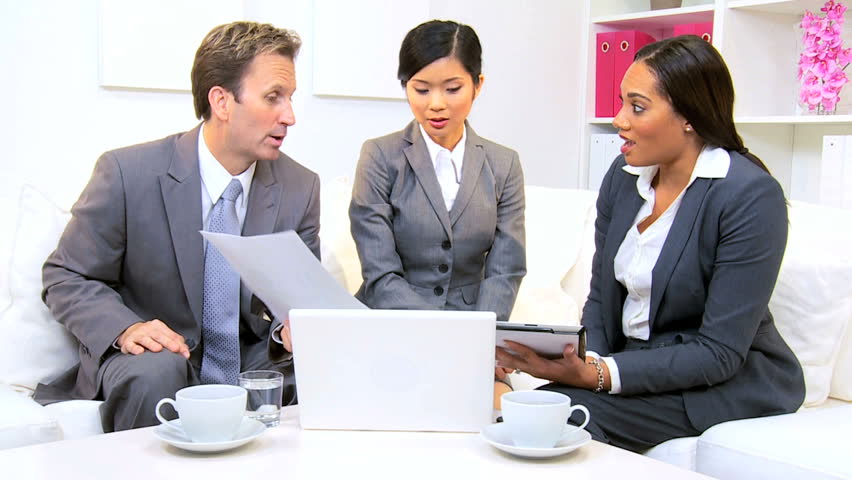 Female African American advertising manager informal meeting of her multi ethnic team