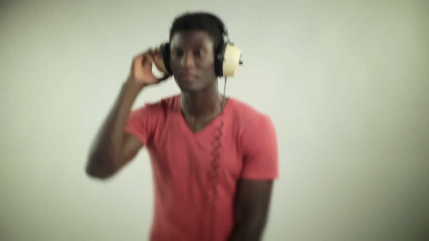 young african guy waving and dancing with a cool attitude on red t-shirt