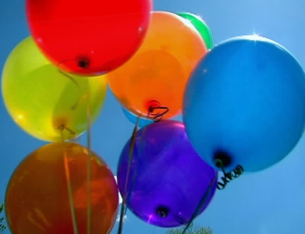 Balloons are let go and float away into space and behind PAL video