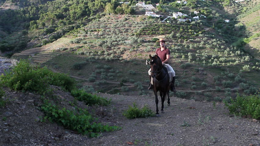 Man riding a horse in Andalusia, Spain