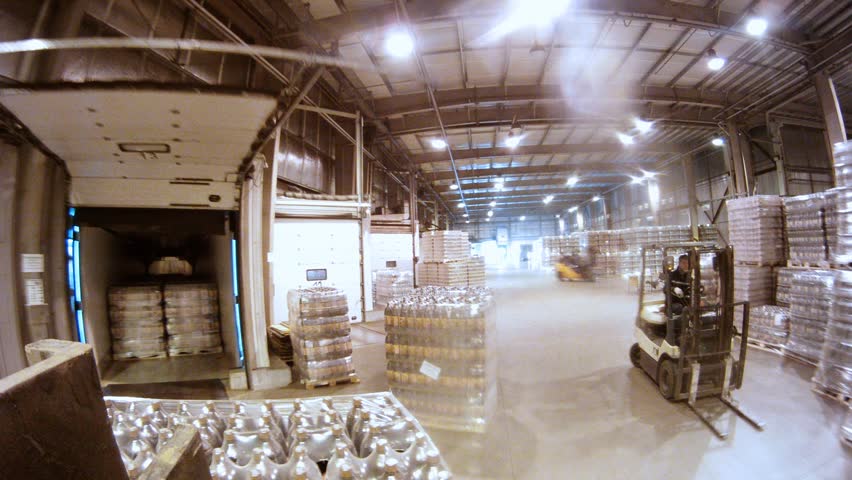 MOSCOW - MAY 31: (Timelapse View) Loader delivers containers with kvass in lorry at nonalcoholic plant Ochakovo, on May 31, 2012 in Moscow, Russia