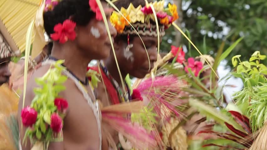 TAMI ISLANDS, PAPUA NEW GUINEA - APRIL 9: Elaborate boat shaped headdresses, flowers, leaves and shells adorn traditional dancers on April 9, 2011 at Tami Island, Papua New Guinea.