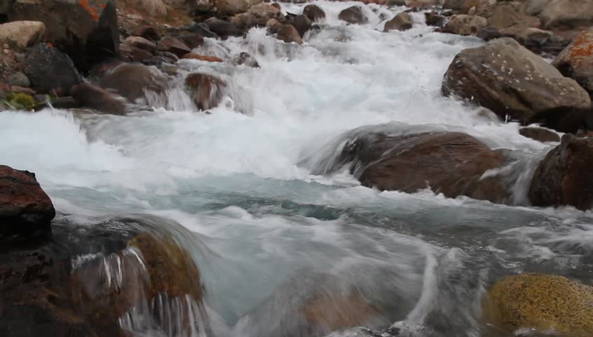 The mountain river with pure, transparent, cold water