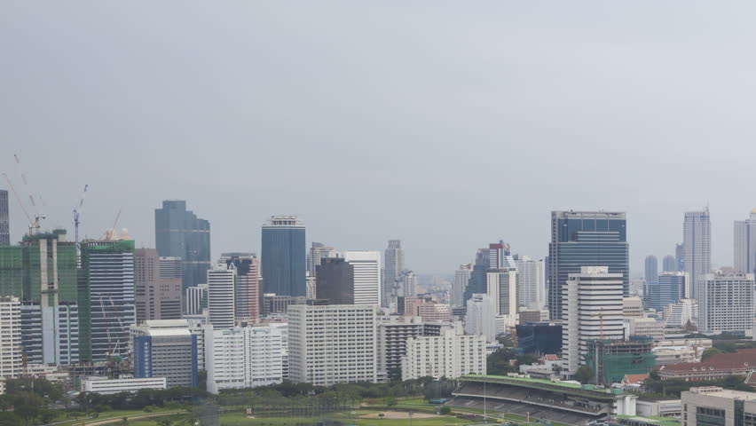 BANGKOK, THAILAND, JUN 01, 2012: Timelapse of Bangkok Skyline and the Royal Bangkok Sports Club hit by a storm during sunset filmed from an elevated position.