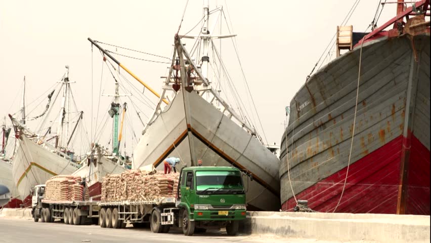 JAKARTA, INDONESIA - AUGUST 26: Time lapse of workers loading cement onto ships at Sunda Kelapa port on August 26, 2012 in Jakarta, Indonesia.