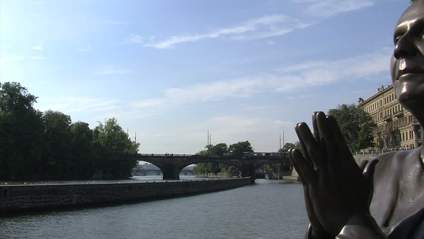 Prague, Czech Republic - July 2012: The statue of Harmony sits along the river's edge