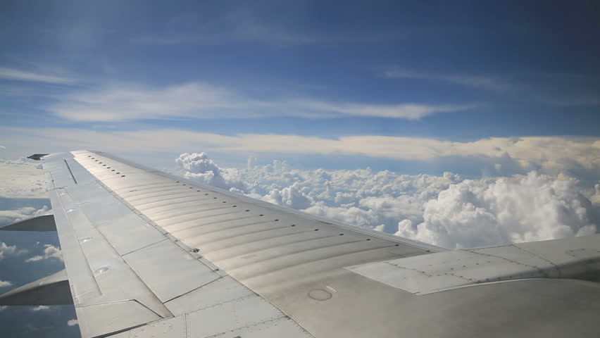 Airplane wing and clouds