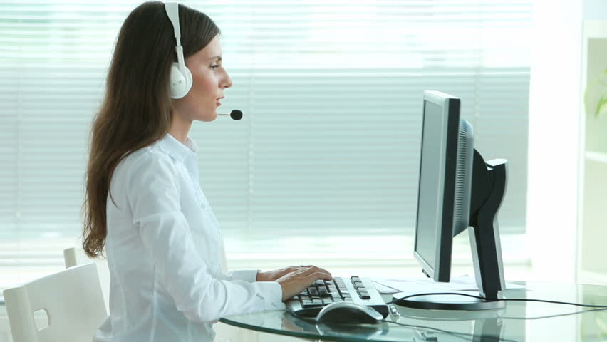 Young support service operator answering the call