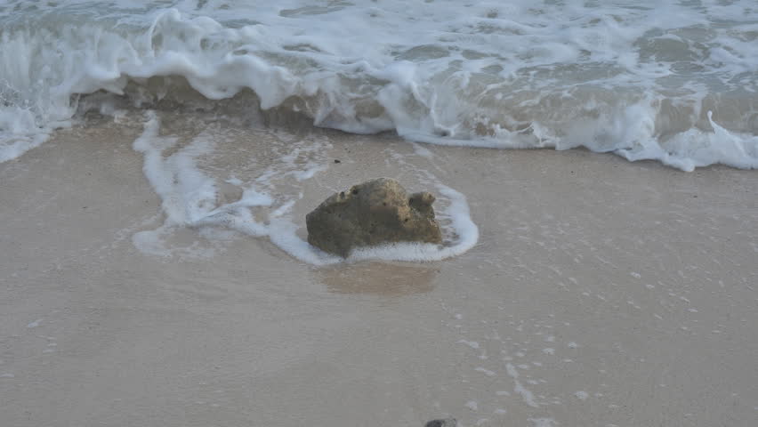 One stone before the waves struck.