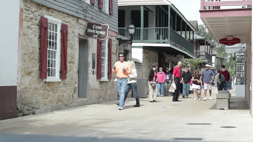 ST. AUGUSTINE, USA - NOVEMBER 6: A group of tourists walking through the historic old town of St. Augustine, Florida, USA. St. Augustine is America's oldest town. It was founded in 1565. 