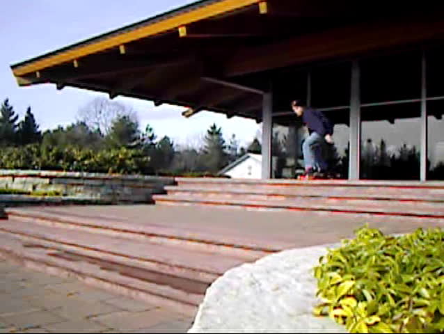 skateboarder jumping three three-sets of stairs