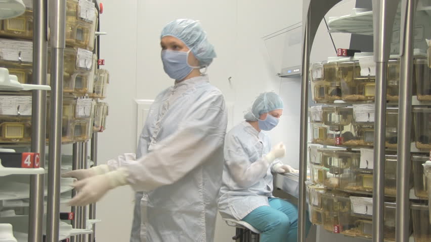 two women work in biology scientific center