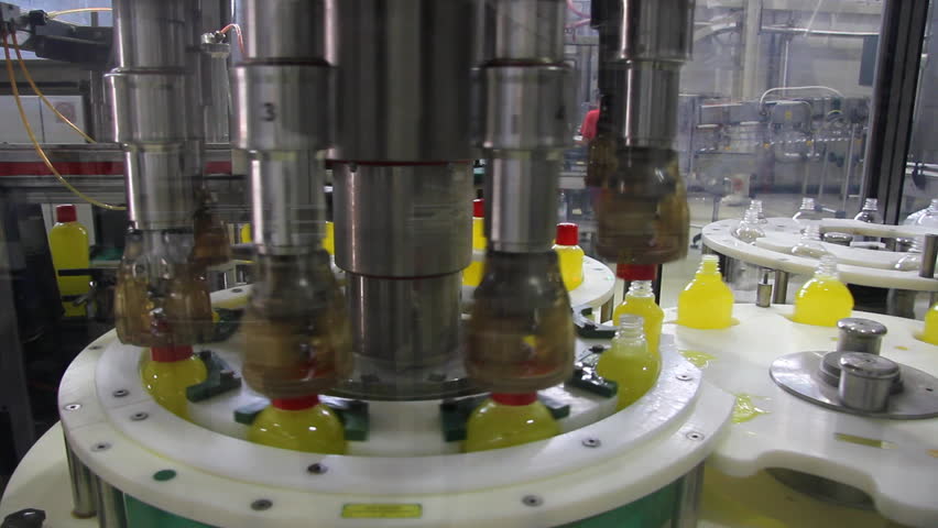 Liquid detergent on automated production line. Machinery for bottling