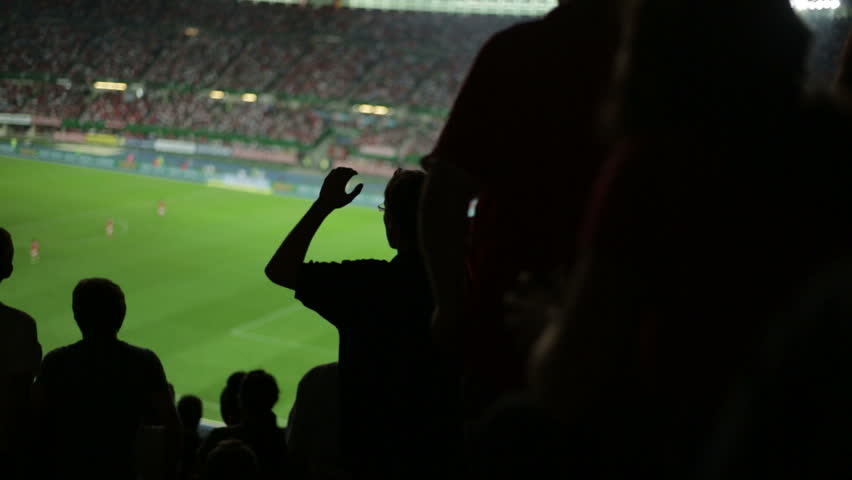 Soccer fans in stadium after a missed goal