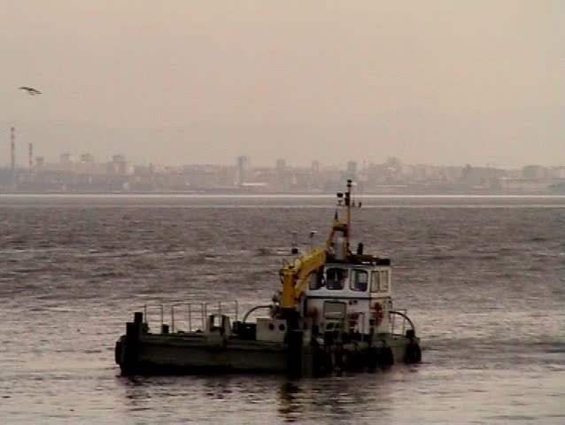 Towboat maneuvering in the port